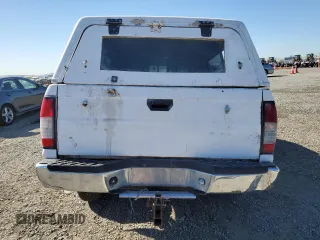 1999 Nissan Frontier XE с VIN 1N6ED26Y1XC308545, выставлен на аукционе Copart как лот 80168984 с пробегом Не указан миль и Списание • Salvage title. История ставок и продаж доступна на DreamBid. Изображение 6.