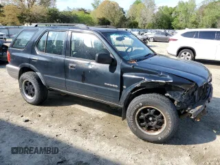 2000 Isuzu Rodeo S with VIN 4S2CK58W7Y4309261, listed as a Copart auction lot 54000775 with 187,949 mi miles and Salvage title. Bid and sale history available at DreamBid. Image 4.