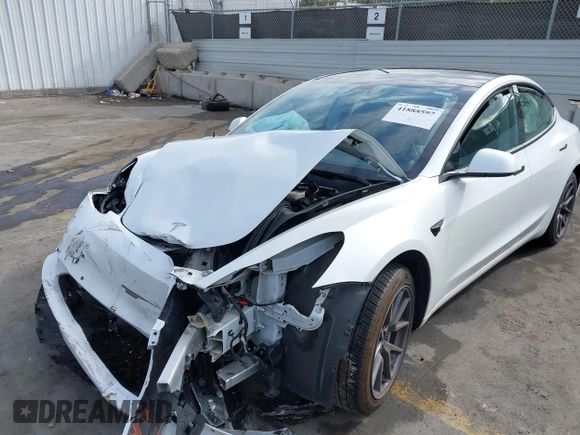 2021 Tesla Model 3 Standard Range Plus z VIN 5YJ3E1EA5MF941392, wystawiony jako IAAI lot #41888597 z przebiegiem 111 617 mil mil oraz . Historia ofert i sprzedaży dostępna na DreamBid. Obrazek 6.