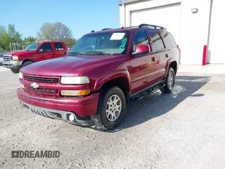 2004 Chevrolet Tahoe Z71 z VIN 1GNEK13T14R275140, wystawiony jako IAAI lot #41986825 z przebiegiem 256 057 mil mil oraz . Historia ofert i sprzedaży dostępna na DreamBid. Obrazek 2.