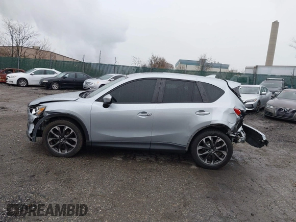 2016 Mazda CX-5 Grand Touring with VIN JM3KE4DY4G0712465, listed as a IAAI auction lot 41859217 with 61,806 mi miles and . Bid and sale history available at carsss.com. Image 15.