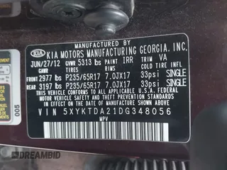 2013 Kia Sorento LX with VIN 5XYKTDA21DG348056, listed as a IAAI auction lot 42020513 with 233,308 mi miles. Bid and sale history available at carsss.com. Image 9.