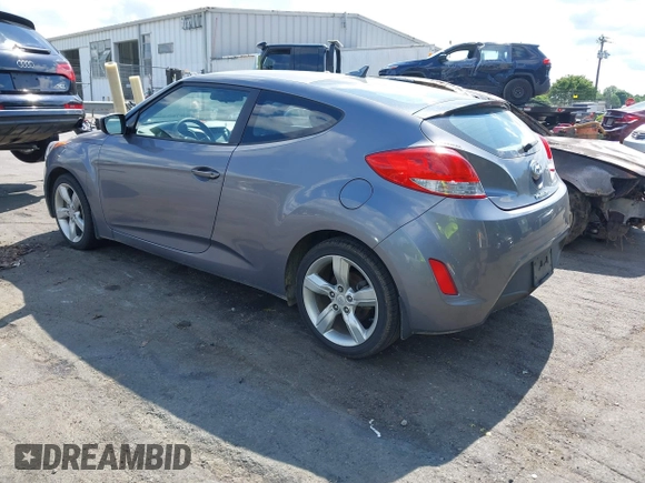 2013 Hyundai Veloster w/Gray Int with VIN KMHTC6ADXDU172104, listed as a IAAI auction lot 42198689 with 67,160 mi miles and . Bid and sale history available at DreamBid. Image 3.