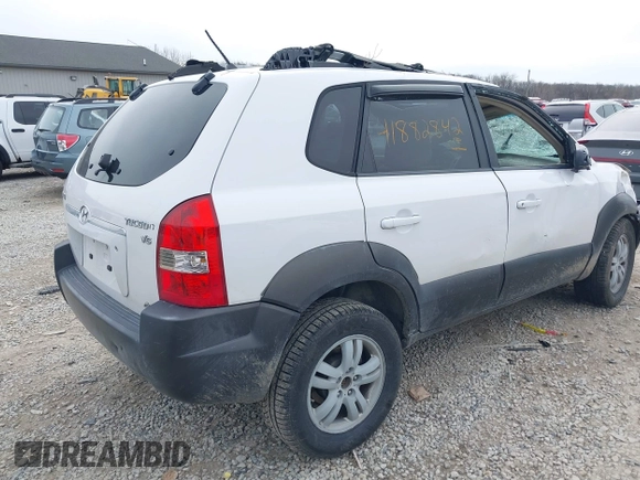 2006 Hyundai Tucson GLS with VIN KM8JN72D26U322893, listed as a IAAI auction lot 41882842 with 116,972 mi miles. Bid and sale history available at carsss.com. Image 4.