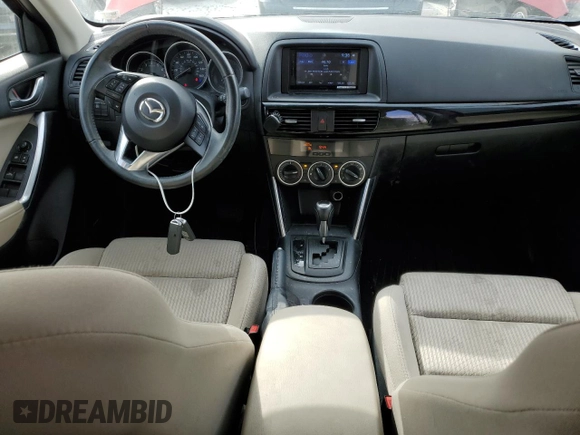 2014 Mazda CX-5 Touring with VIN JM3KE2CY6E0316041, listed as a Copart auction lot 52227835 with 69,921 mi miles and Salvage Title. Bid and sale history available at DreamBid. Image 8.