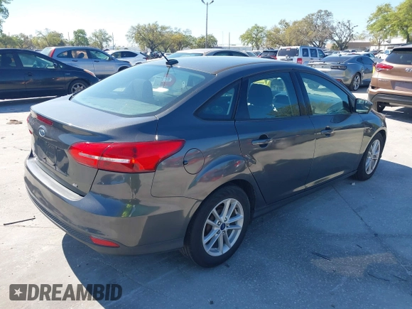 2018 Ford Focus SE z VIN 1FADP3F27JL245603, wystawiony jako IAAI lot #41773395 z przebiegiem 94 044 mil mil oraz . Historia ofert i sprzedaży dostępna na DreamBid. Obrazek 4.