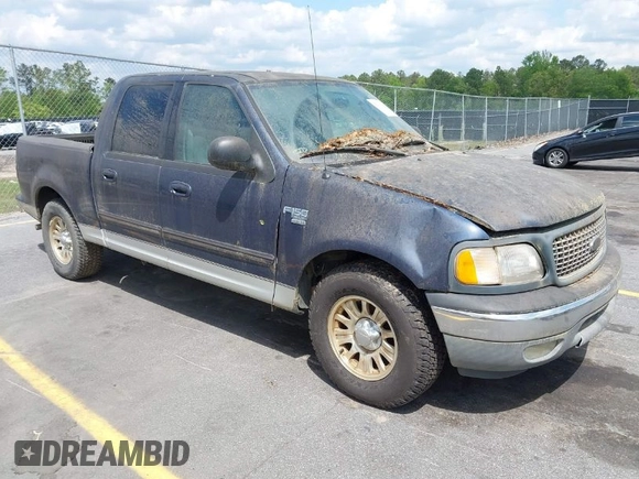 2003 Ford F-150 XLT with VIN 1FTRW076X3KC61967, listed as a IAAI auction lot 42016065 with 206,256 mi miles. Bid and sale history available at carsss.com. Image 1.