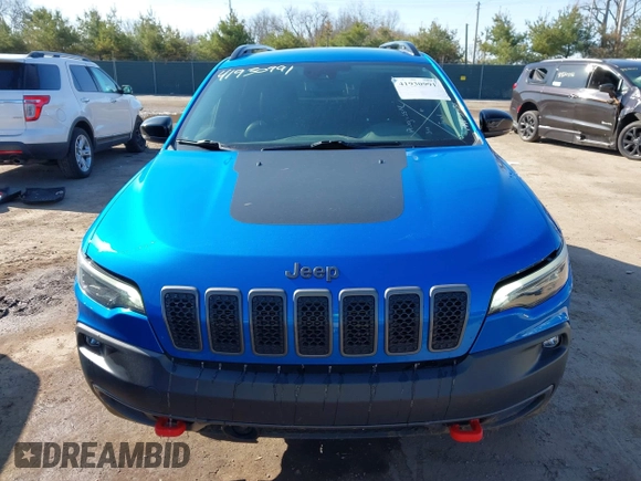 2022 Jeep Cherokee Trailhawk z VIN 1C4PJMBX5ND553336, wystawiony jako IAAI lot #41930991 z przebiegiem 40 832 mil mil oraz . Historia ofert i sprzedaży dostępna na DreamBid. Obrazek 13.