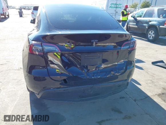 2024 Tesla Model Y Long Range with VIN 7SAYGDEEXRF983040, listed as a IAAI auction lot 41555332 with 79,506 mi miles and . Bid and sale history available at DreamBid. Image 6.