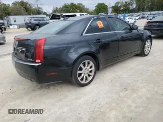 2009 Cadillac CTS AWD w/1SA with VIN 1G6DH577590123416, listed as a Copart auction lot 48297495 with 142,728 mi miles and Salvage Title. Bid and sale history available at carsss.com. Image 3.