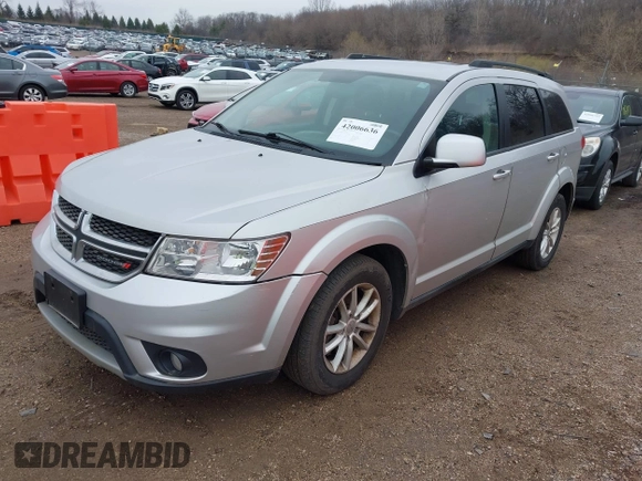 2013 Dodge Journey SXT with VIN 3C4PDCBG1DT647014, listed as a IAAI auction lot 42006636 with 192,911 mi miles. Bid and sale history available at carsss.com. Image 2.