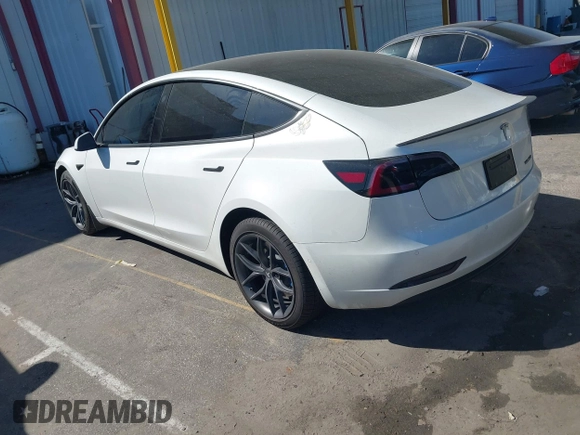 2020 Tesla Model 3 Standard Range Plus with VIN 5YJ3E1EA1LF659765, listed as a IAAI auction lot 41834411 with 42,433 mi miles and . Bid and sale history available at carsss.com. Image 3.