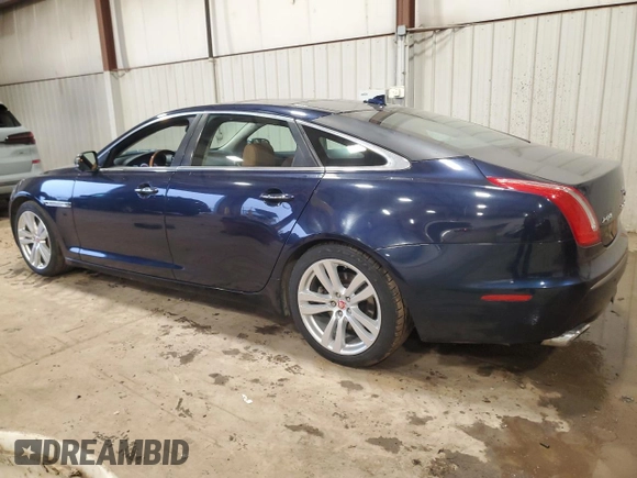 2014 Jaguar XJ Portfolio with VIN SAJWJ2GD7E8V67473, listed as a Copart auction lot 43968705 with 99,146 mi miles and Salvage title. Bid and sale history available at DreamBid. Image 2.