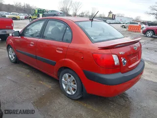 2009 Kia Rio SX with VIN KNADE223796561406, listed as a IAAI auction lot 41650749 with 100,041 mi miles. Bid and sale history available at carsss.com. Image 3.