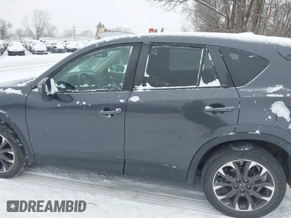 2016 Mazda CX-5 Grand Touring with VIN JM3KE4DY2G0913412, listed as a IAAI auction lot 41616132 with 85,166 mi miles. Bid and sale history available at carsss.com. Image 14.
