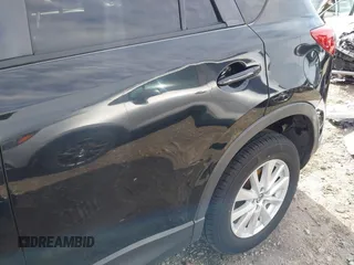 2014 Mazda CX-5 Touring with VIN JM3KE2CY9E0333951, listed as a IAAI auction lot 41825345 with 124,684 mi miles. Bid and sale history available at carsss.com. Image 17.