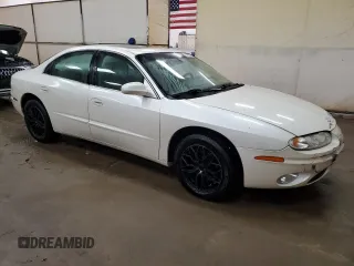 2003 Oldsmobile Aurora z VIN 1G3GS64C534171677, wystawiony jako Copart lot #74768254 z przebiegiem 113 932 mil mil oraz Tytuł czysty. Historia ofert i sprzedaży dostępna na DreamBid. Obrazek 4.