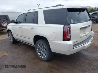 2015 GMC Yukon Denali with VIN 1GKS2CKJ7FR737165, listed as a IAAI auction lot 41914478 with 156,059 mi miles. Bid and sale history available at carsss.com. Image 3.