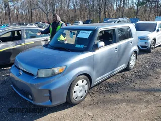 2012 Scion xB with VIN JTLZE4FE1CJ010574, listed as a IAAI auction lot 41858422 with 65,862 mi miles. Bid and sale history available at carsss.com. Image 2.