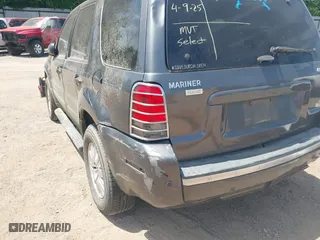 2005 Mercury Mariner Luxury with VIN 4M2CU57195DJ25103, listed as a IAAI auction lot 42032296 with 154,134 mi miles. Bid and sale history available at carsss.com. Image 6.