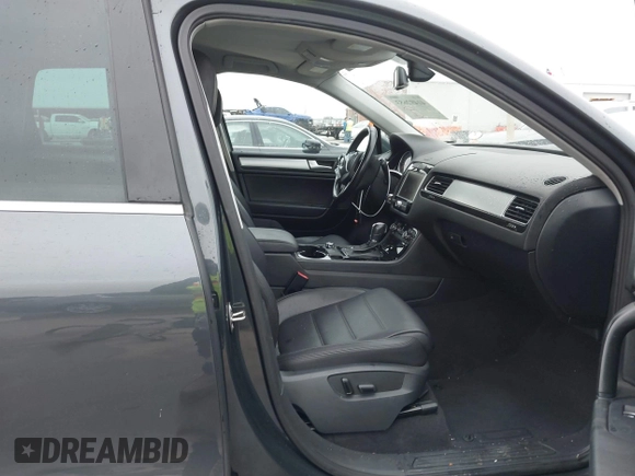 2012 Volkswagen Touareg Sport with VIN WVGEF9BP9CD008545, listed as a IAAI auction lot 41492653 with 138,424 mi miles and . Bid and sale history available at DreamBid. Image 5.