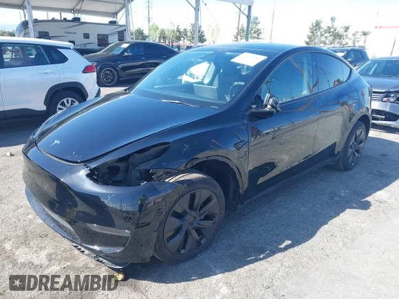 2025 Tesla Model Y Long Range with VIN 7SAYGDEE9SF278607, listed as a IAAI auction lot 41932084 with 9,667 mi miles and . Bid and sale history available at carsss.com. Image 2.