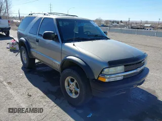 2000 Chevrolet Blazer LS z VIN 1GNCT18W7YK298489, wystawiony jako IAAI lot #41422643 z przebiegiem 194 207 mil mil oraz . Historia ofert i sprzedaży dostępna na DreamBid. Obrazek 1.