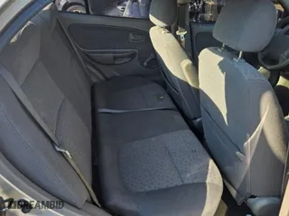 2004 Kia Rio with VIN KNADC125546325654, listed as a Copart auction lot 65521594 with 157,436 mi miles and Salvage Title. Bid and sale history available at carsss.com. Image 9.