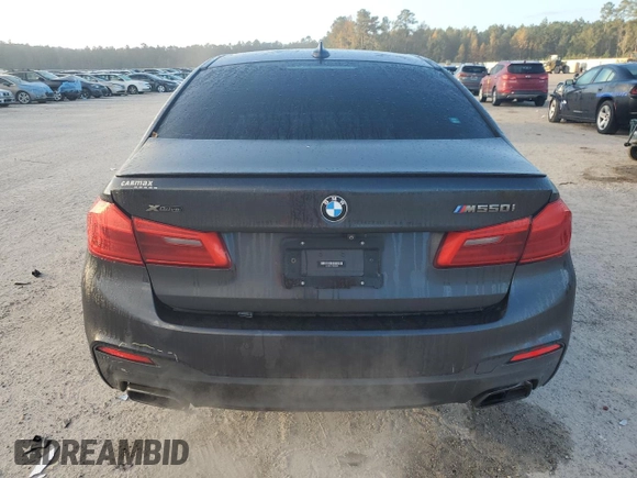 2019 BMW 5 Series M550i xDrive with VIN WBAJB9C57KB288906, listed as a Copart auction lot 79846274 with 61,744 mi miles and Salvage title. Bid and sale history available at DreamBid. Image 6.