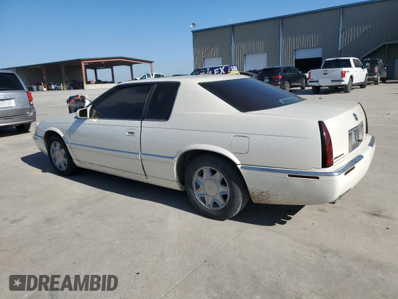 2000 Cadillac Eldorado z VIN 1G6EL12Y0YB702117, wystawiony jako Copart lot #80297854 z przebiegiem 124 851 mil mil oraz Szkoda całkowita • Salvage title. Historia ofert i sprzedaży dostępna na DreamBid. Obrazek 2.