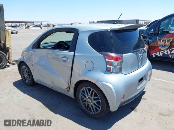 2014 Scion iQ with VIN JTNJJXB02EJ027026, listed as a IAAI auction lot 42619439 with 103,261 mi miles and . Bid and sale history available at DreamBid. Image 3.