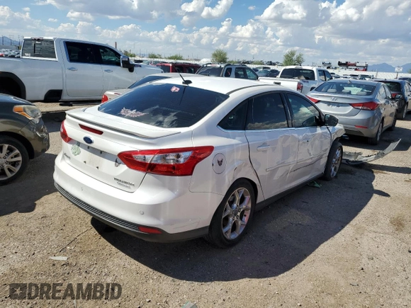 2014 Ford Focus Titanium with VIN 1FADP3J26EL132223, listed as a Copart auction lot 71490004 with 131,233 mi miles and Salvage Title. Bid and sale history available at DreamBid. Image 3.