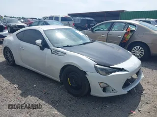 2014 Scion FR-S z VIN JF1ZNAA19E9703160, wystawiony jako IAAI lot #42105322 z przebiegiem 117 299 mil mil oraz . Historia ofert i sprzedaży dostępna na DreamBid. Obrazek 1.
