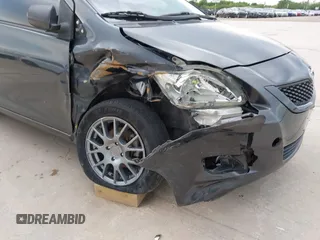 2009 Toyota Yaris with VIN JTDBT903994050383, listed as a IAAI auction lot 42134282 with 122,824 mi miles and . Bid and sale history available at DreamBid. Image 6.