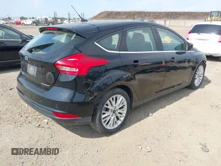 2017 Ford Focus Titanium with VIN 1FADP3N29HL319759, listed as a IAAI auction lot 42458289 with 213,674 mi miles and . Bid and sale history available at DreamBid. Image 4.