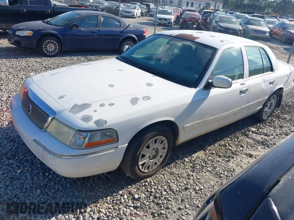2004 Mercury Grand Marquis GS z VIN 2MEFM74W74X654151, wystawiony jako IAAI lot #42185493 z przebiegiem 203 017 mil mil oraz . Historia ofert i sprzedaży dostępna na DreamBid. Obrazek 2.
