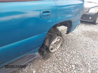 2001 GMC Yukon SLT z VIN 1GKEK13TX1J191325, wystawiony jako IAAI lot #42306665 z przebiegiem Nie podano mil oraz . Historia ofert i sprzedaży dostępna na DreamBid. Obrazek 11.
