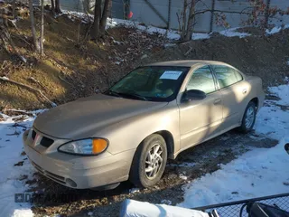 2004 Pontiac Grand Am SE with VIN 1G2NE52F24C231559, listed as a IAAI auction lot 41606544 with 65,524 mi miles. Bid and sale history available at carsss.com. Image 2.