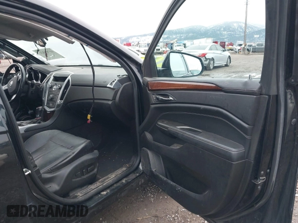 2012 Cadillac SRX Premium Collection with VIN 3GYFNFE35CS599969, listed as a IAAI auction lot 41764337 with 154,864 mi miles and . Bid and sale history available at DreamBid. Image 5.