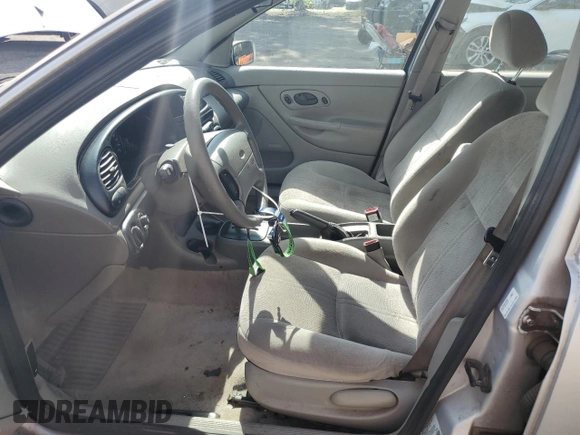 1998 Ford Contour LX with VIN 1FAFP66L2WK290948, listed as a Copart auction lot 56204295 with 76,307 mi miles and Salvage title. Bid and sale history available at DreamBid. Image 7.