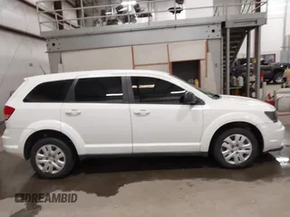 2015 Dodge Journey American Value z VIN 3C4PDCAB4FT714200, wystawiony jako IAAI lot #42199910 z przebiegiem 205 009 mil mil oraz . Historia ofert i sprzedaży dostępna na DreamBid. Obrazek 13.