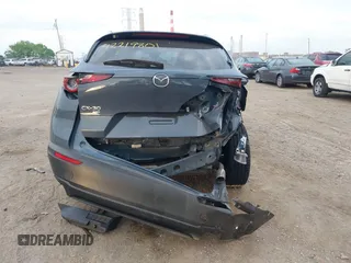 2023 Mazda CX-30 S Carbon Edition with VIN 3MVDMBCM4PM577619, listed as a IAAI auction lot 42219801 with 24,784 mi miles and . Bid and sale history available at DreamBid. Image 16.