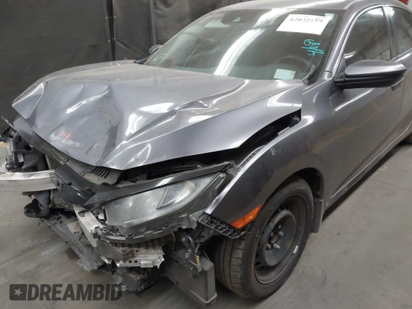 2020 Honda Civic LX with VIN 19XFC2F67LE006057, listed as a IAAI auction lot 42032759 with 119,319 mi miles and . Bid and sale history available at DreamBid. Image 6.