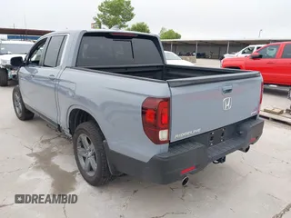 2023 Honda Ridgeline RTL with VIN 5FPYK3F58PB047099, listed as a IAAI auction lot 42313390 with Not provided miles and . Bid and sale history available at DreamBid. Image 3.