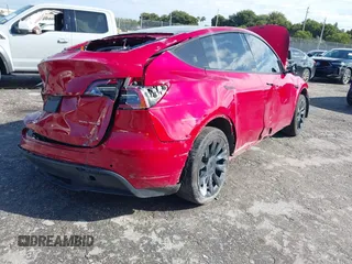 2022 Tesla Model Y Long Range z VIN 7SAYGDEE1NF385414, wystawiony jako IAAI lot #41660542 z przebiegiem 54 075 mil mil oraz . Historia ofert i sprzedaży dostępna na DreamBid. Obrazek 4.
