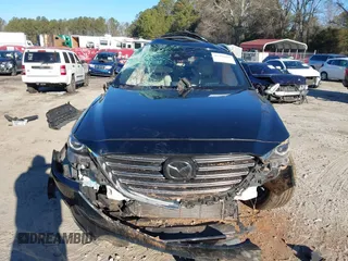 2018 Mazda CX-9 Grand Touring z VIN JM3TCADY5J0204845, wystawiony jako IAAI lot #41292695 z przebiegiem 98 751 mil mil oraz . Historia ofert i sprzedaży dostępna na DreamBid. Obrazek 12.
