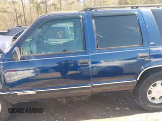 1999 GMC Yukon with VIN 1GKEK13R2XJ708582, listed as a IAAI auction lot 41698586 with 252,630 mi miles. Bid and sale history available at carsss.com. Image 14.
