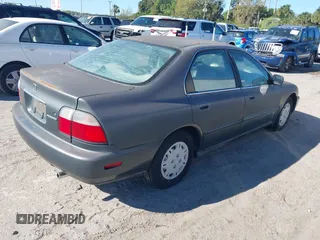 1997 Honda Accord Value with VIN 1HGCD5689VA182425, listed as a IAAI auction lot 41702660 with 208,005 mi miles and . Bid and sale history available at carsss.com. Image 4.