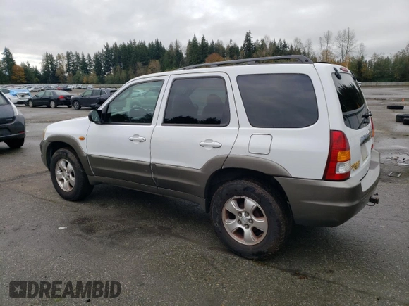 2001 Mazda Tribute LX with VIN 4F2CU08101KM11452, listed as a Copart auction lot 76796064 with 175,584 mi miles and Salvage Title. Bid and sale history available at DreamBid. Image 2.