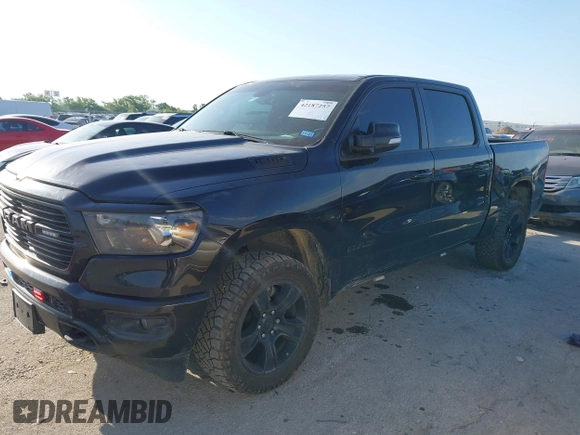 2021 Ram 1500 Big Horn with VIN 1C6SRFFT1MN520081, listed as a IAAI auction lot 42187257 with 186,011 mi miles and . Bid and sale history available at DreamBid. Image 2.